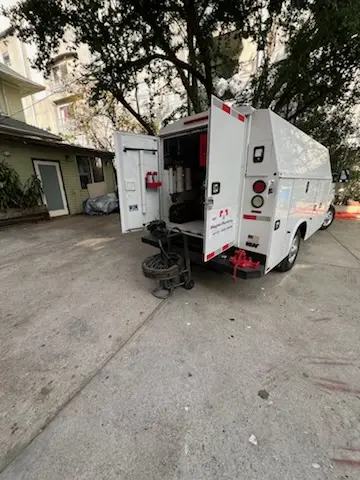 Magnet Plumbing service vehicle on-site for Grease Trap Cleaning in Wasilla